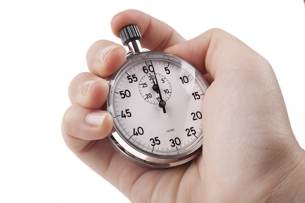 Female Hand holting silver color stopwatch isolated on white background